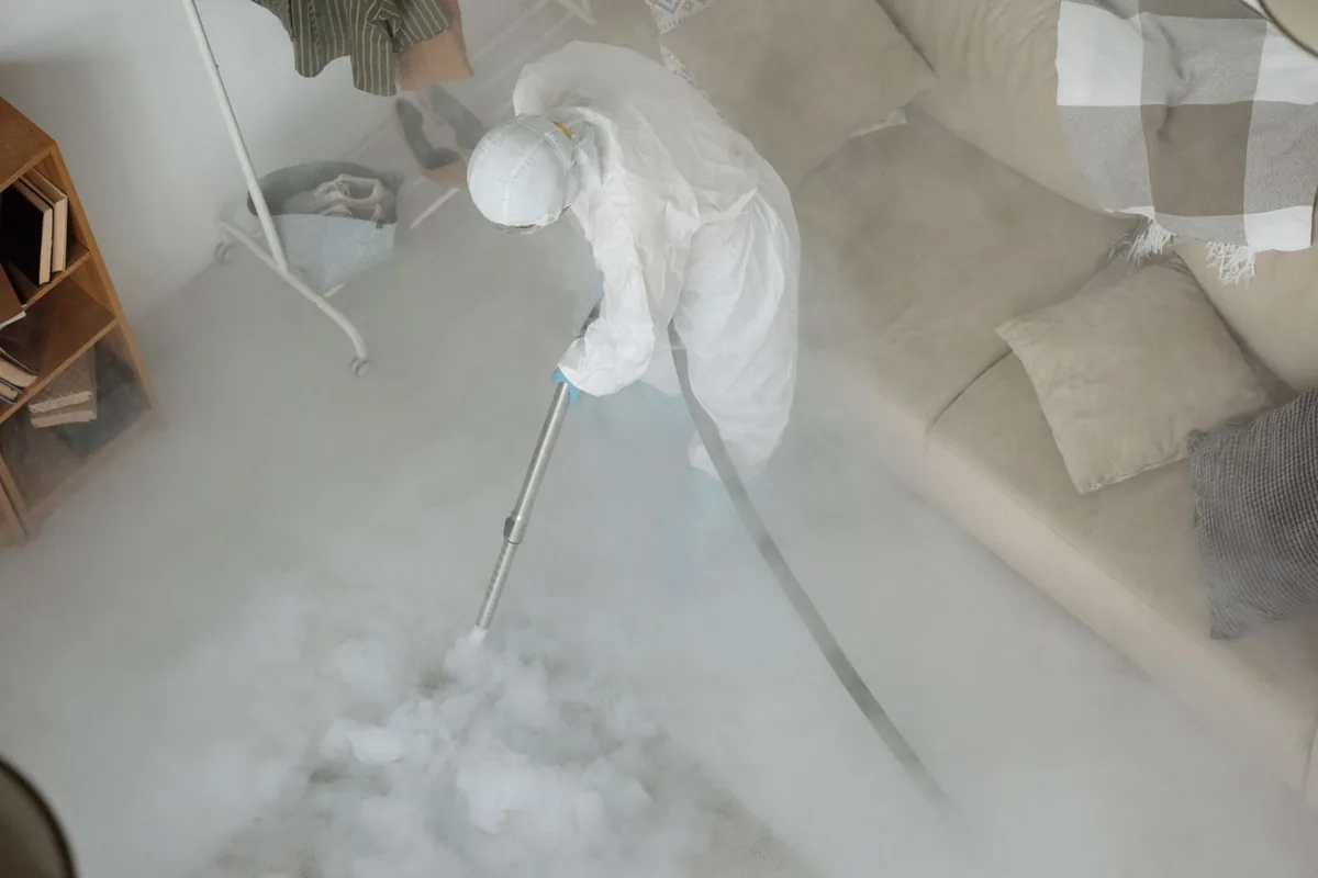 Biohazard cleanup technician in protective equipment, Dexter, GA